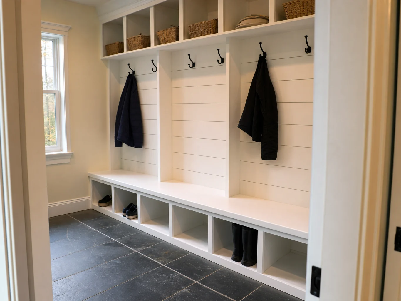 Custom mudroom with built in bench, cubbies and shiplap