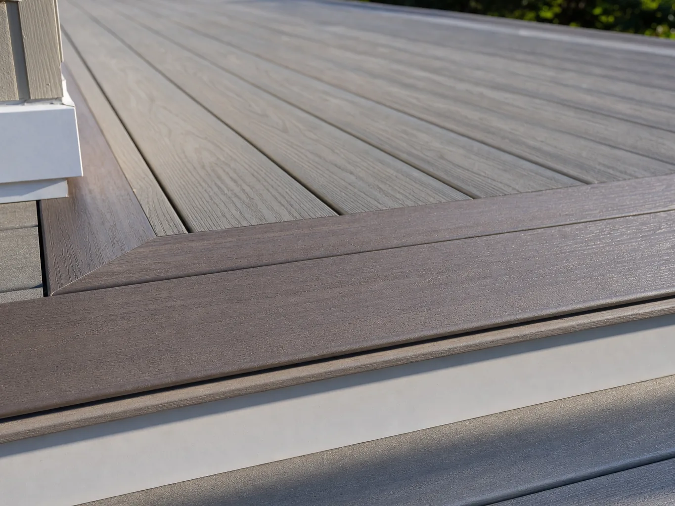 Deck boards with hidden fasteners and a picture frame border