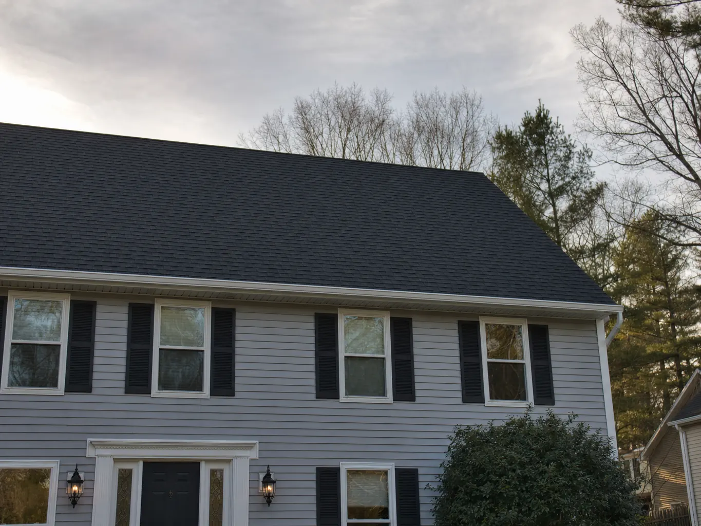 New charcoal architectural shingle roof on a two story colonial