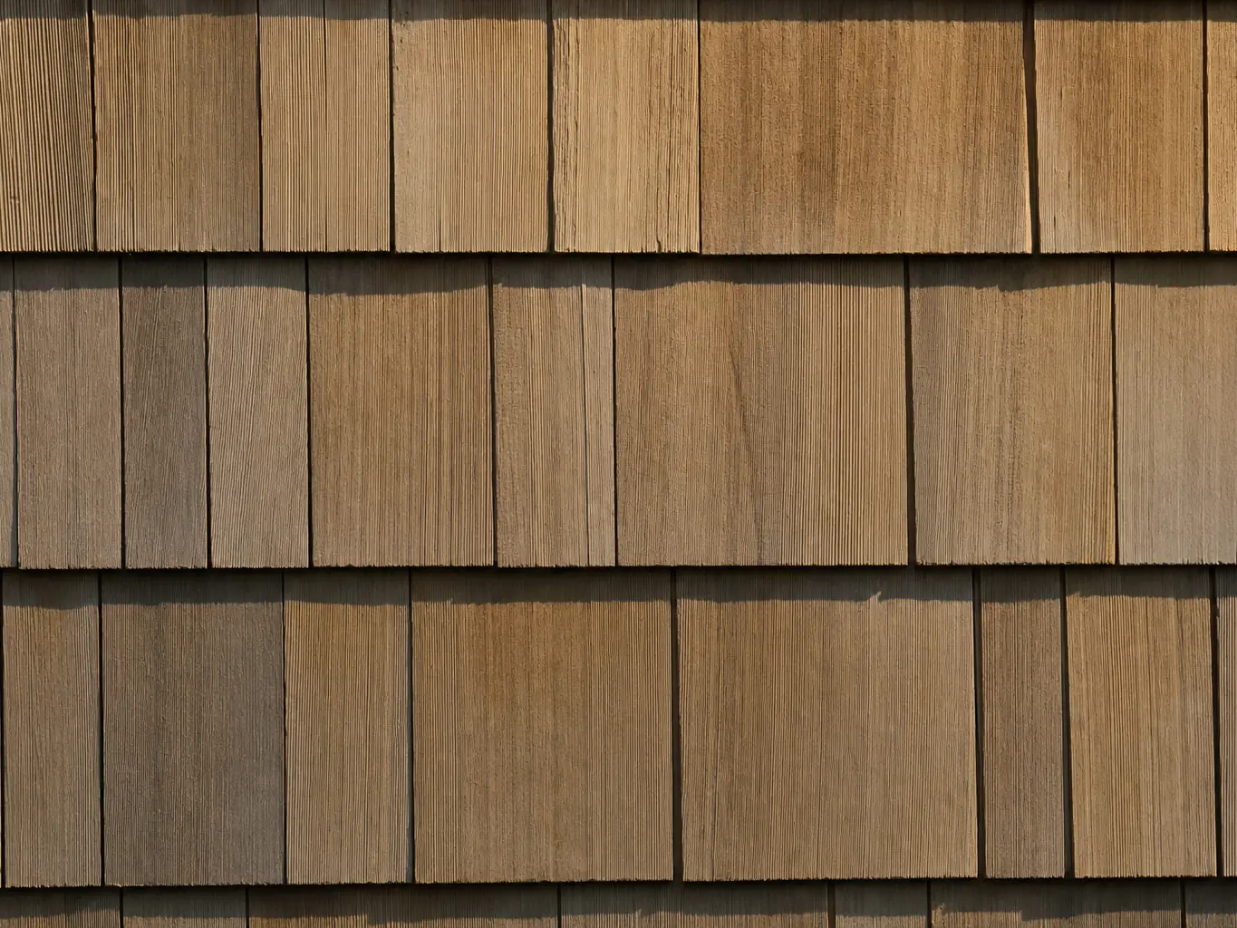 Close view of newly installed cedar shake siding courses